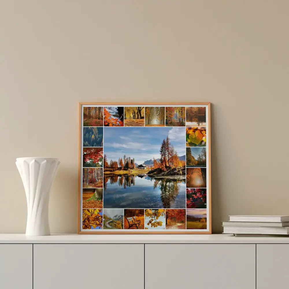 Herbst-Fotocollage mit Bergsee und buntem Laub im Holzrahmen, auf einer weißen Kommode neben Vase und Büchern